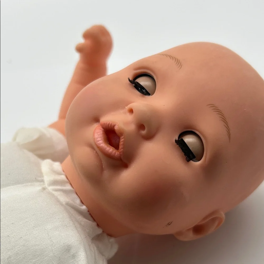 Realistic Baby Doll with White Outfit